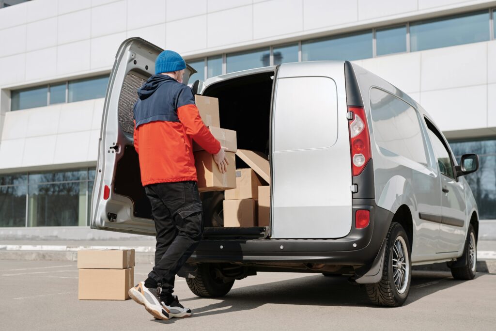 Buying or Leasing a Van - man loading boxes into van
