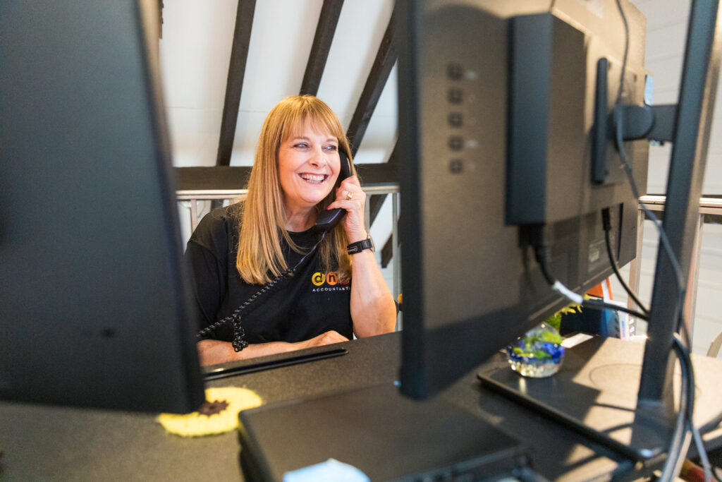 Gillian (woman) talking on the phone about pension tax-free myths