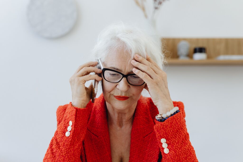 Woman on the phone thinking about is Your £2 Million Estate Facing an Inheritance Tax Trap?